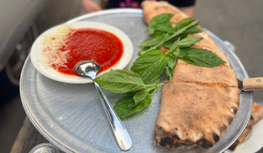 Lucali signature dishes Calzone
Fusilli Pasta
Plain Pie
